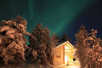 Фото номера Коттедж с 1 спальней и сауной Дома для отпуска Ounasloma Luxury Cottages г. Энонтекиё 3